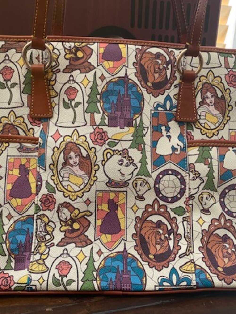 Beauty and the Beast Tote by Dooney & Bourke.